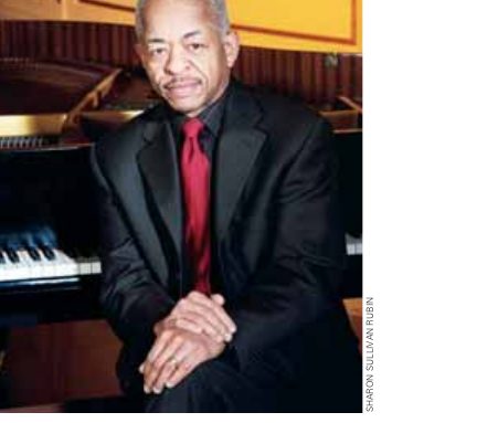 Adegoke Steve Colson seated at a piano, from the DownBeat feature, April 2010